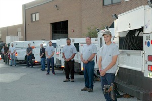 Skilled HVAC technicians undergoing factory-certified training for latest technology expertise