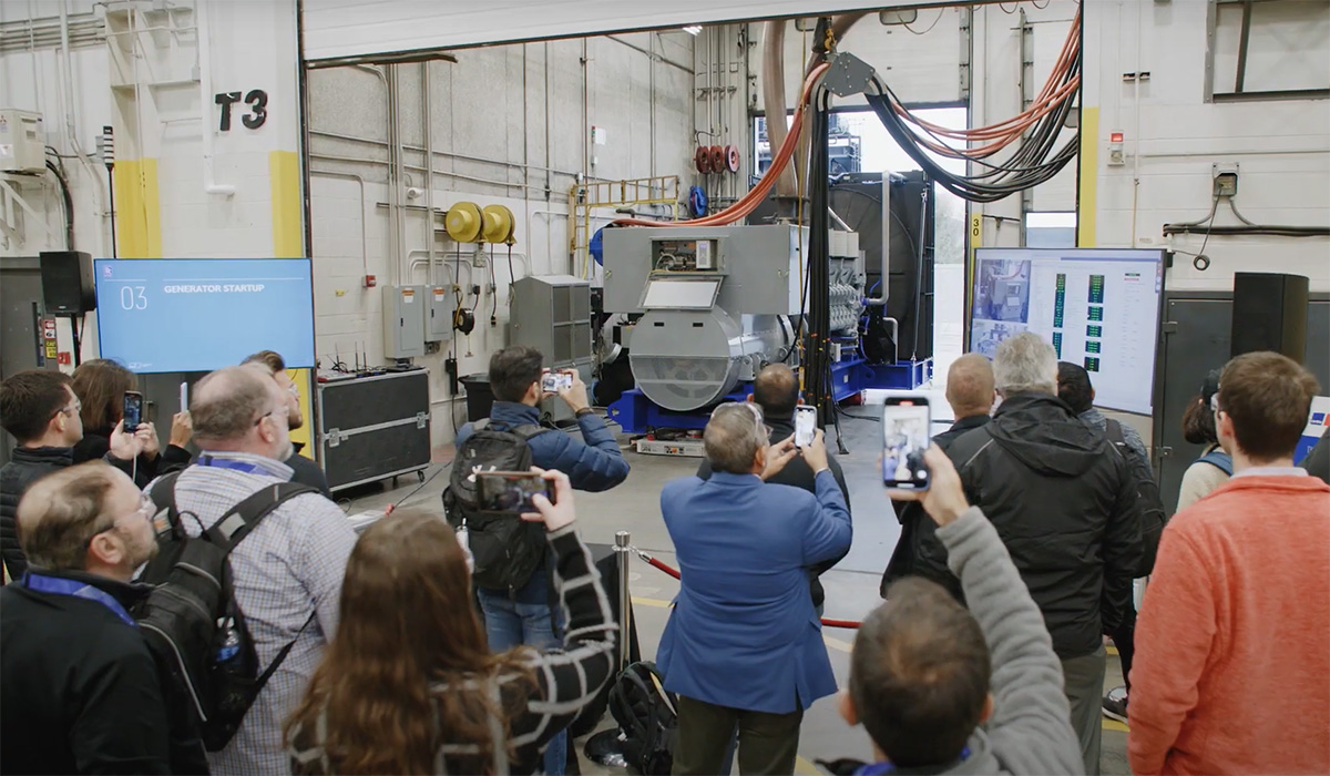 Photo of Symposium attendees viewing a genset